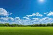 © Abah - Wide grassy field under a bright blue sky filled with fluffy white clouds and a shining sun