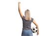 © Ljupco Smokovski - Rear view shot of a happy young woman cheering with a football