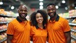© Viktor - Three smiling diverse supermarket employees stand together in orange polo shirts. Appear friendly, helpful, ready to assist customers with shopping needs. Teamwork, positive staff attitude evident.