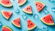 © wolfelarry - Red watermelon slices, clear ice cubes float on light blue water surface. Ripples, water droplets splash around fresh fruit pieces