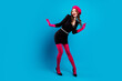 © deagreez - Chic bright fashion model in pink gloves beret and black dress smiles against blue backdrop