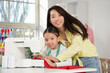 © Pixel-Shot - Happy Asian mother and her daughter working with sewing machine in workshop