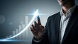 © Tazmin - Businessman interacting with a growing graph symbolizing success and growth in finance and technology