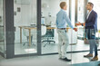 © ReeseFullyOwned/peopleimages.com - Businessman, team and discussion at office with advice, listen and insight at investment company. People, talk and mentor with broker, consultant and review for wealth management career at agency