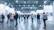 © Curioso.Photography - Large crowd moving through a modern exhibition hall during a trade fair representing business networking and industry events.