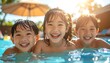 © Zaky - Three beaming children splash in a bright blue pool, illuminated by golden sunlight. Their faces radiate joy and playful exuberance