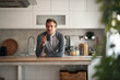 © Jelena - Relaxed Man Enjoying Coffee In A Modern Home Kitchen Morning Moment At The Counter
