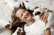 © Tatyana Gladskih - Happy teen girl play with small Puppies dogs