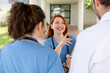© StockMe - Medical professional laughing and discussing with colleagues, showing teamwork and positive communication within healthcare workers, having a happy moment during a break