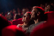 © Photoenthusiast82 - Couple watching a ln action movie in a movie crowded theater