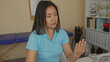 © Krakenimages.com - Woman in clinic room displaying various nonverbal gestures at office desk, conveying emotions while having a conversation in a healthcare environment with professional equipment.
