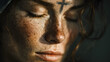 © Selvam - Ash Wednesday. Close-up of a woman with her eyes closed, ash cross marked on her forehead.