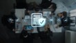 © InfiniteFlow - This image depicts a business meeting focused on security compliance with digital icons symbolizing data protection strategies and corporate governance efforts. Raster