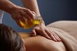 © OHMAl2T - Relaxing Massage with Essential Oil Pouring on a Spa Client's Back