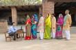 © GAJENDRRA BHATI  - Rural indian people standing in a queue to get their documents verified to get benefits of government scheme.