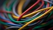 © Bussakon - Abstract ro view of tangled color coded electrical wires creating an intricate pattern with vibrant hues