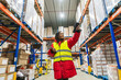 © Koldo_Studio - Woman wearing warm clothing scanning inventory with a barcode reader in a low temperature logistics warehouse
