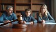 © Pete - Family court session with parents and child present before judge gavel. Legal decision on custody and child welfare impacts family dynamics. Courtroom scene shows solemn atmosphere.
