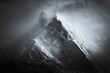 © Ilia Kupchikov - Dramatic Black and White Mountain Peak in Storm Clouds