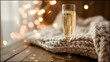 © 洁 张 - dcf. A champagne flute with golden bubbles on a wooden table beside a cozy blanket and festive confetti. bar promotions, beverage menus, designed for food & beverage menus and cafe branding.