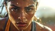 © DhimasPratama - extreme close-up portrait of sweaty female athlete with intense gaze and determination during high intensity training