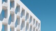 © xartproduction - Minimalist White Architectural Facade with Geometric Openings Against Blue Sky