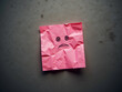 © Ingmar - Sad face on crumpled pink sticky note with copy space