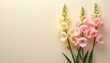 © Maryna - Pastel snapdragons in soft pink, creamy yellow colors are arranged elegantly on light beige backdrop. Delicate petals, green stems create gentle bloom composition suitable for spring, summer themes.