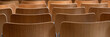© Chris Lawrence - Panorama of rows of empty wooden chairs for use as a background texture