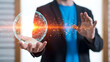 © Sehar - Businessman in blue shirt and black blazer holding glowing orb with particles and light effect