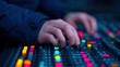 © Nitchalee N. - Social detox for creatives, A close-up of hands adjusting colorful controls on a sound mixer, creating a vibrant atmosphere in a music or audio production setting.