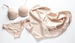 © absifa - Luxury beige lingerie set on white.