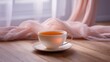 © Matcha_09 - Serene cup of steaming tea on wooden table next to soft fabric drapes in a bright and calming interior setting for relaxation and leisure moments