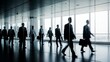 © A5 - Silhouettes of Business People Walking in Brightly Lit Modern Office Building Hallway with Large Windows, Corporate Commute