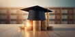© Rizvan - Tuition payment for graduate studies shown by a black graduation cap atop coins, emphasizing education costs, International Students Day