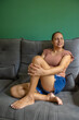 © BRUNO DIAS - Mature woman relaxing on sofa at home holding coffee cup