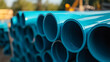 © A2Z AI  - Stacked, vibrant blue piping awaiting installation. The pipes gleam in the sunlight, hinting at a construction project or infrastructure upgrade in a lively outdoor area.
