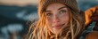 © Georgii - Smiling young woman with blue eyes enjoying a day in nature outdoors