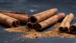 © Imam - Cinnamon sticks with ground cinnamon in a clean studio setup, highlighting warm spice texture, culinary flavor, and natural ingredients for food and wellness concepts.