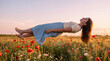 © Rendara Studio - Teenage girl drifting peacefully above wildflowers at sunset