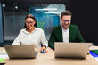 © Home-stock - Graphic designers businesspeople working in office with laptops, working with new ideas in advertising agency, sitting in board room in office