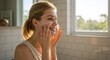 © NN AI - Smiling young woman washing her face with foam cleanser. Happy female enjoying her daily skincare routine in sunlit bathroom