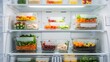 © Tiana_Geo - Well-organized refrigerator filled with glass containers of healthy meal prep. Ideal for nutrition blogs, diet plans, kitchen organization guides, and lifestyle social media content.