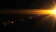 © busya - Bright golden light burst with lens flare against a black background