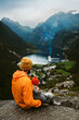 © EVERST - Father and baby family travel in Norway summer vacations outdoor people tourists sightseeing Geiranger fjord natural landmark parent with child together enjoying nature scenery active holidays tour