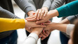© digital pic - Diverse group of people joining hands in a supportive circle