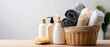 © pvl0707 - Basket of colorful towels and hygiene products on wooden table with clean white background showcasing bath and body care supplies