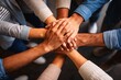 © Alamin - Diverse Hands Stacked Together in a Circle from Above, Symbolizing Teamwork and Unity