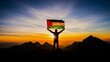 © Mohammed - A person holding a Palestinian flag on a mountain at sunset