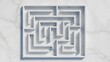 © SubaDesigns - Minimalist white maze on a marble background, representing complex problem-solving, strategy, and challenges in business or life